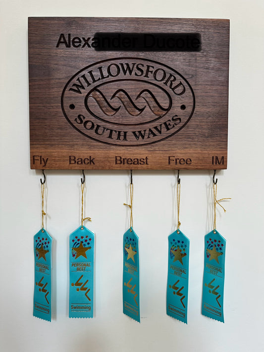 Handcrafted maple personalized swimming achievement board for Willowsford South Waves team with custom engraved swimmer's name