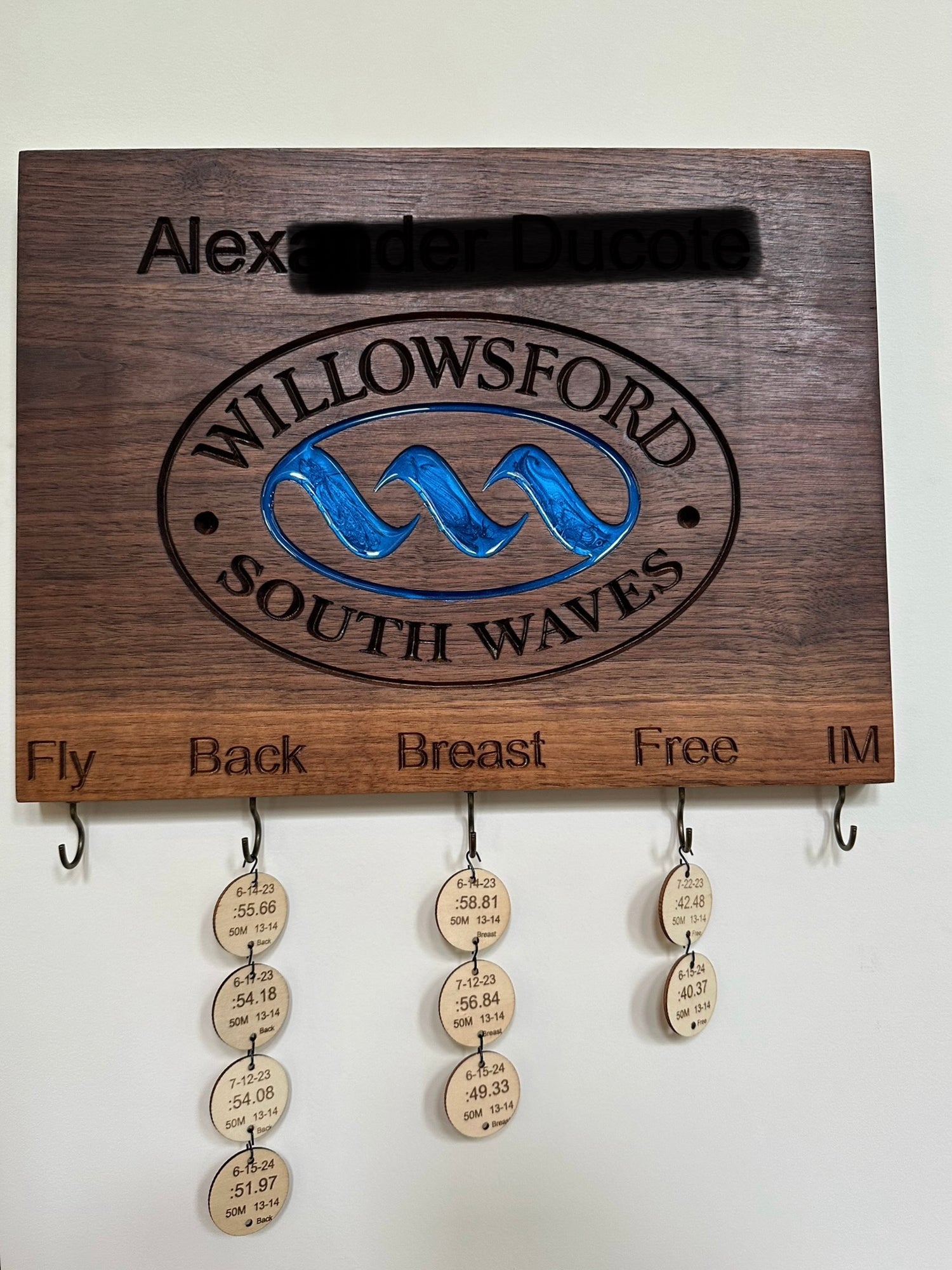 Handcrafted maple personalized swimming achievement board for Willowsford South Waves team with custom engraved swimmer's name